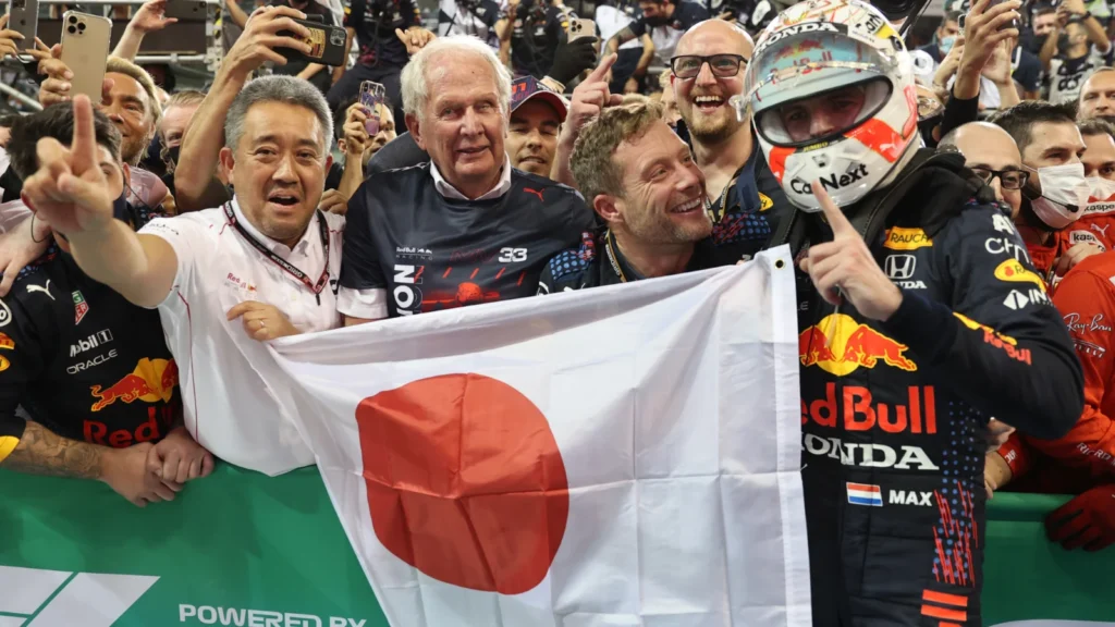 1st place and new World Champion, Max Verstappen (NLD) Red Bull Racing RB16B with Masashi Yamamoto (JPN) Honda Racing F1 Managing Director and Dr Helmut Marko (AUT) Red Bull Motorsport Consultant. 12.12.2021. Formula 1 World Championship, Rd 22, Abu Dhabi Grand Prix, Yas Marina Circuit, Abu Dhabi, Race Day